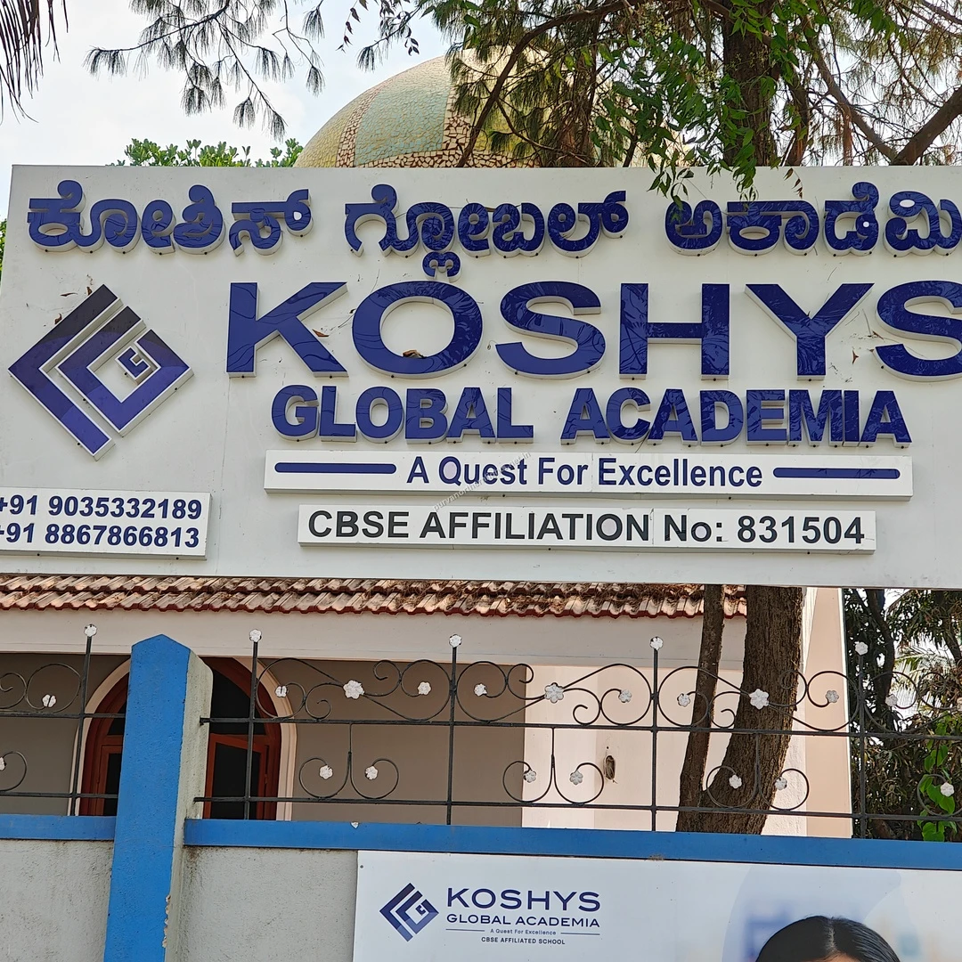 Koshys Campus Signage A clear shot of the Koshys Global Academia campus signage showing its commitment to excellence in education for nearby residents.