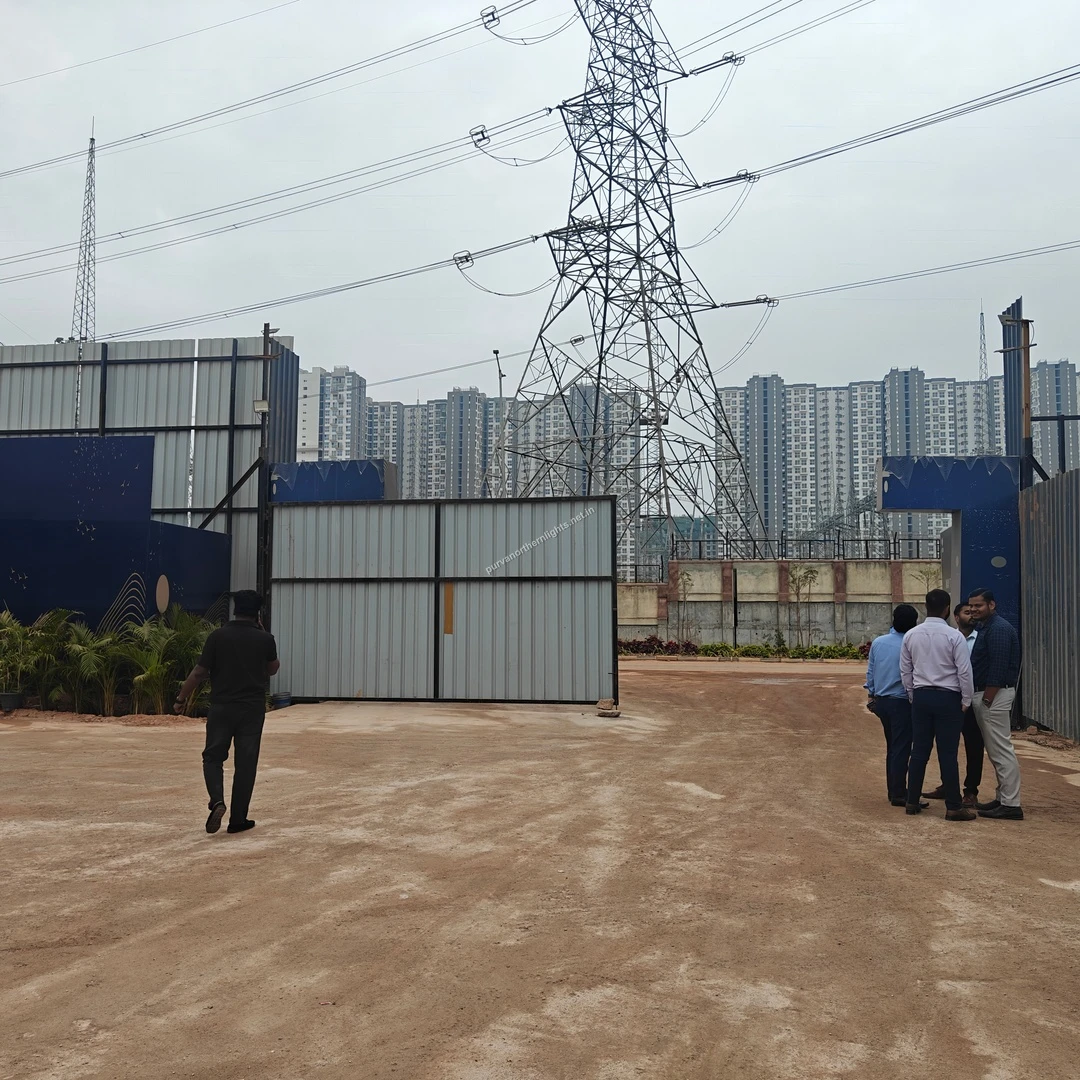 Sales Office Entrance View of the main entrance to the temporary sales office at Purva Northern Lights showing gates and background towers